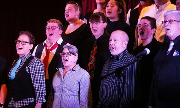 Photograph of three rows of choir singers