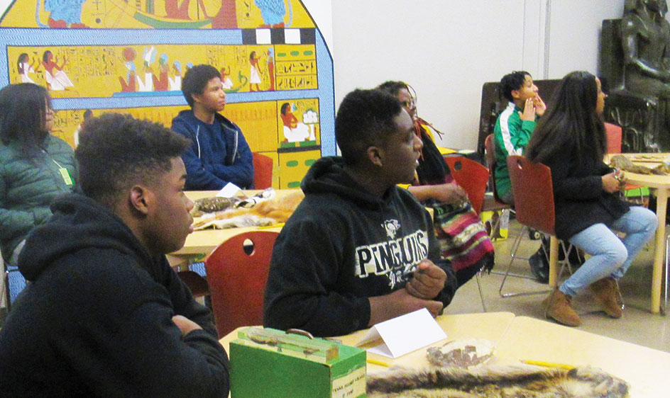 Teens with Focus on Renewal sit at classroom tables with creative projects.