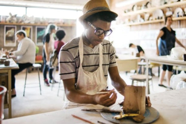 A person working on crafts inside the Manchester Craftsmen's Guild