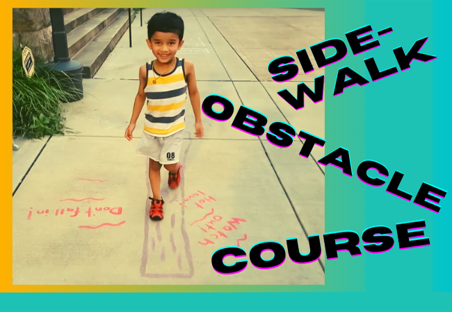 Small boy on the sidewalk obstacle course at Andrew Carnegie Free Library & Music Hall