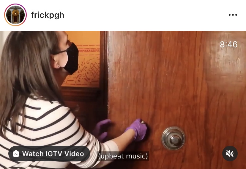 Instagram screenshot of a woman in a mask unlocking a cabinet for the Frick Pittsburgh's behind-the-scenes virtual tour.