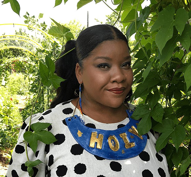 Photo of Vanessa German, Visiting Artist at The Frick Pittsburgh, in black and white polka dot top.