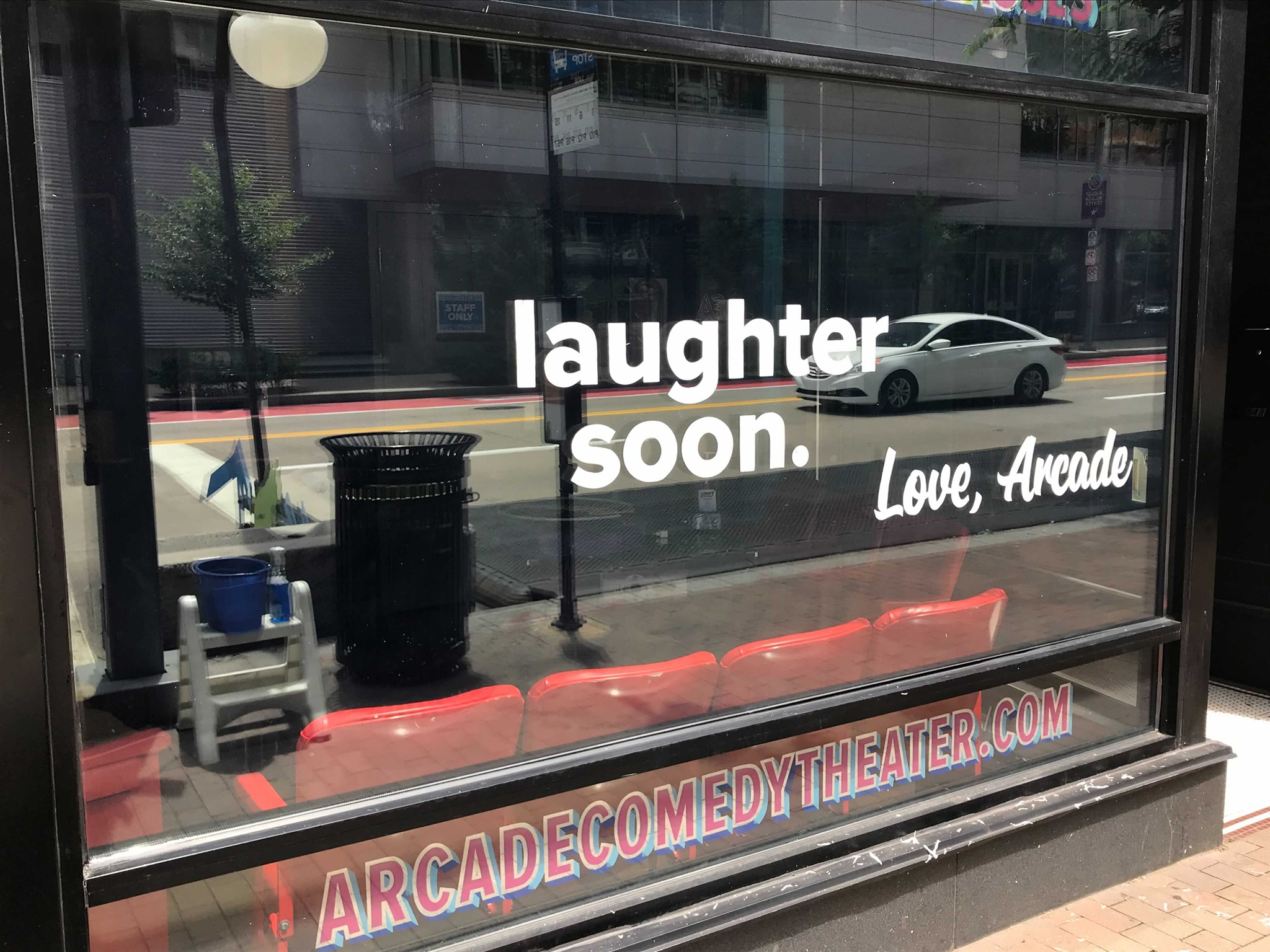 Arcade Comedy theaters front window.