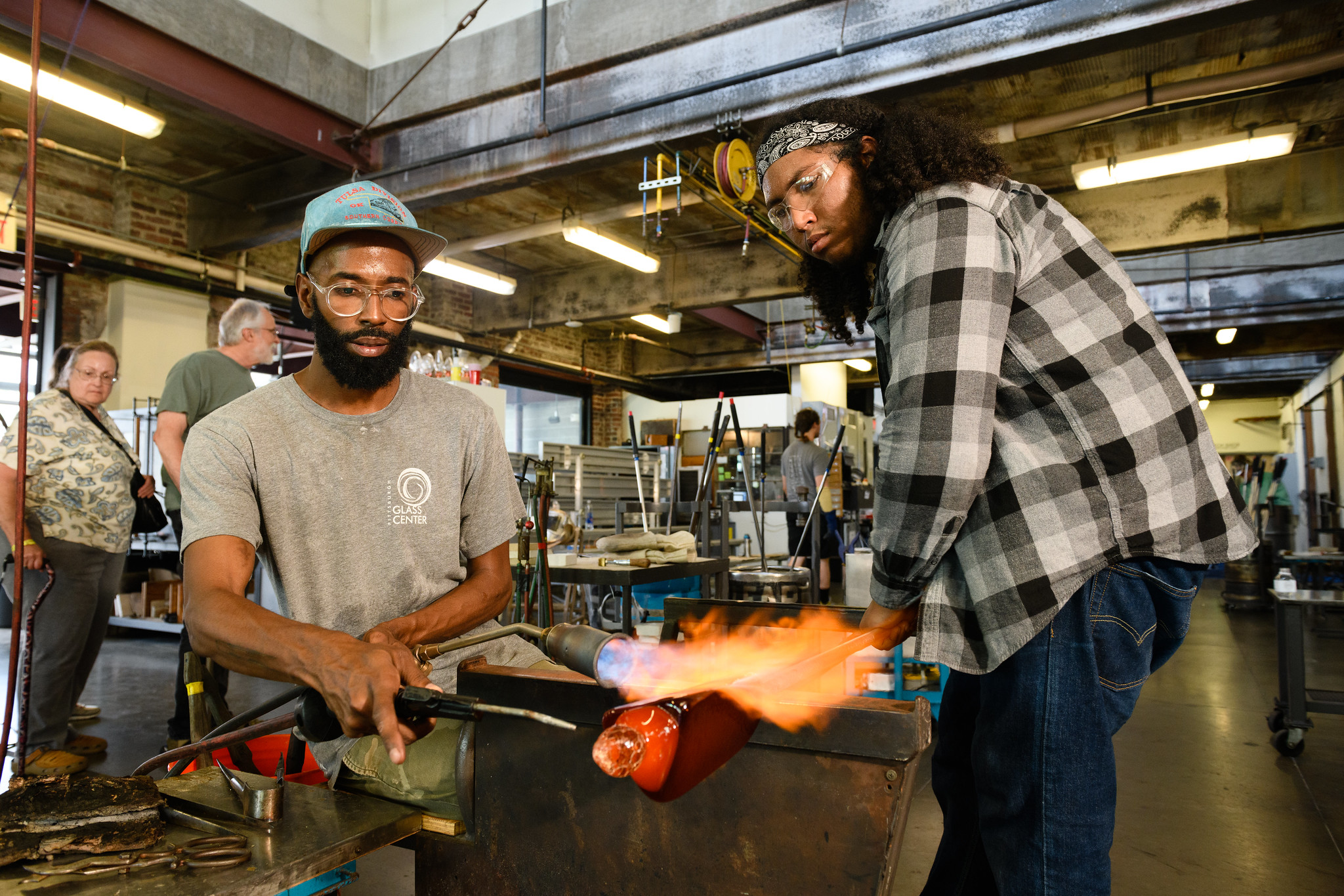 Two people demonstrating at the Pittsburgh Glass Center