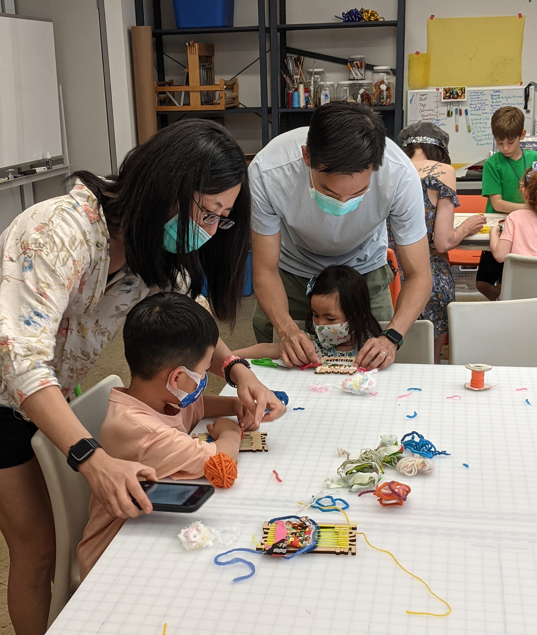 Family crafting at a table