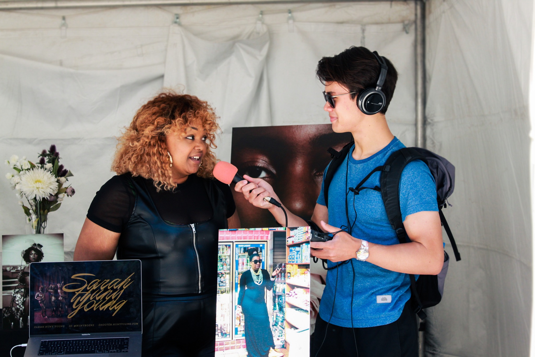 SLB Radio student, Lance Wilhelm, interviewing an artist at a Juneteenth celebration