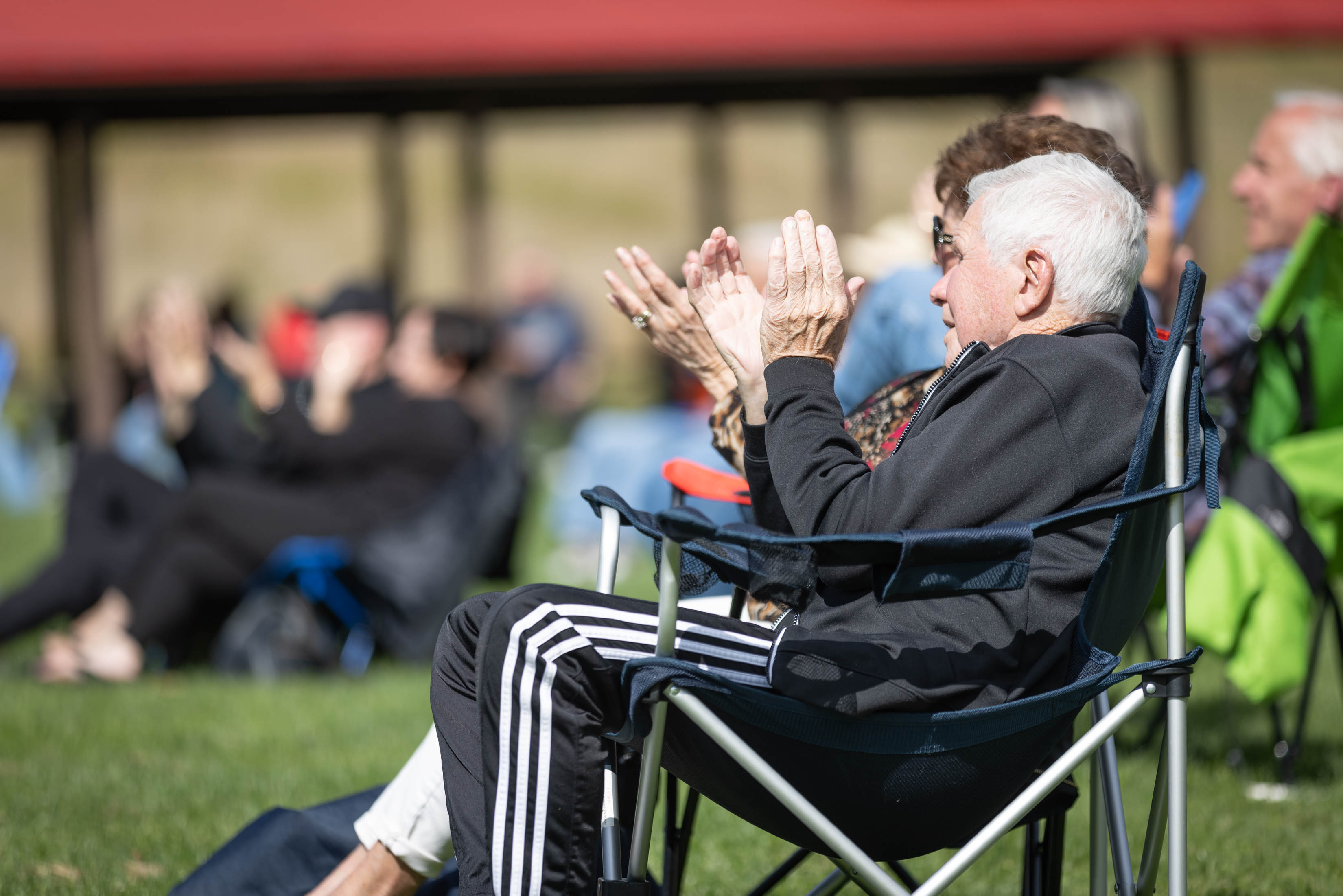 Concertgoer sitting in lawn chair