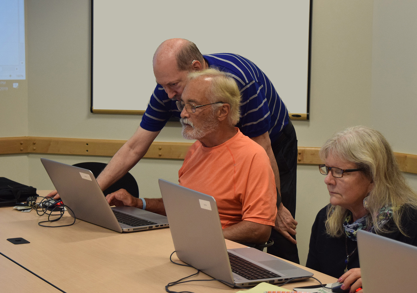 Seniors using laptops at Northland Public Library