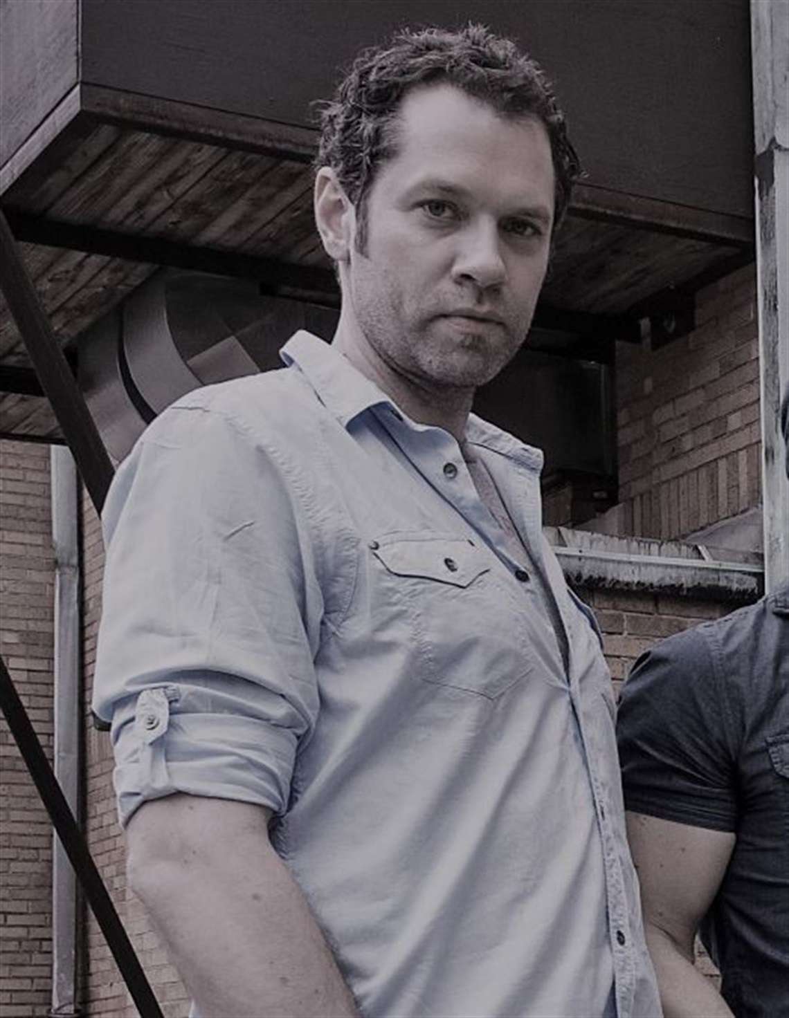 Photograph of Jeff Schmutz wearing a button down shirt