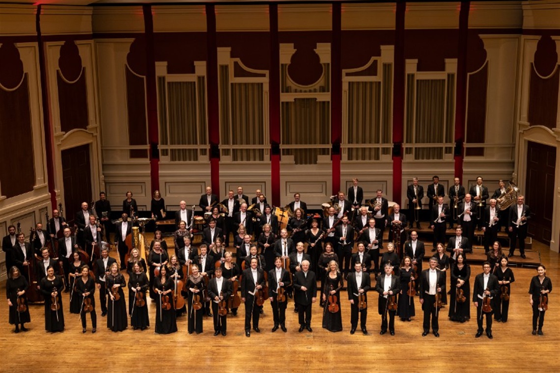 Group photo of the Pittsburgh Symphony Orchestra on stage at Heinz Hall