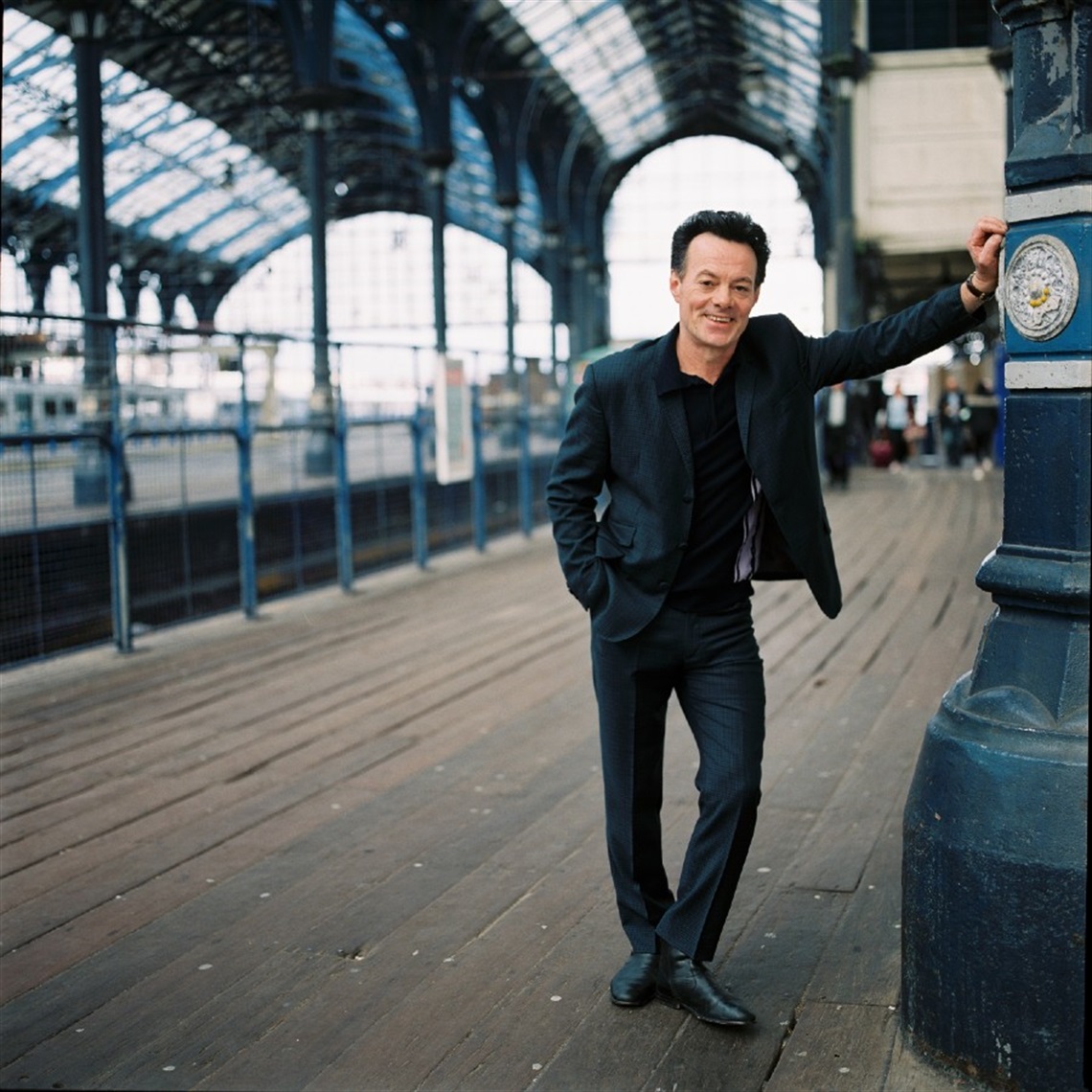 Photograph of James Hunter on a train platform