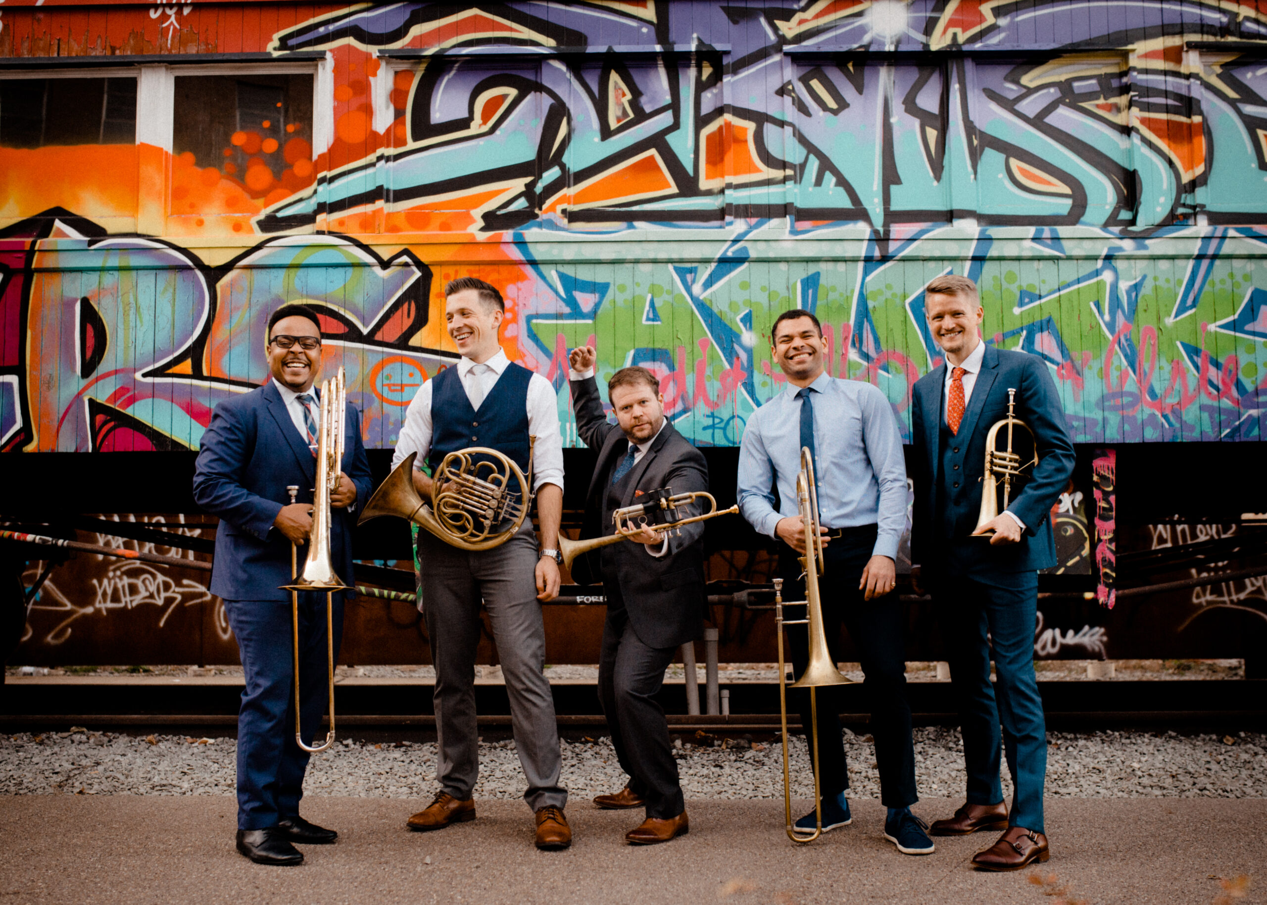 Photograph of C Street Brass posing with their instruments