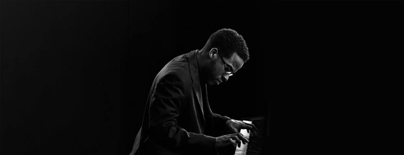 Photograph of Alton Merrell at a piano