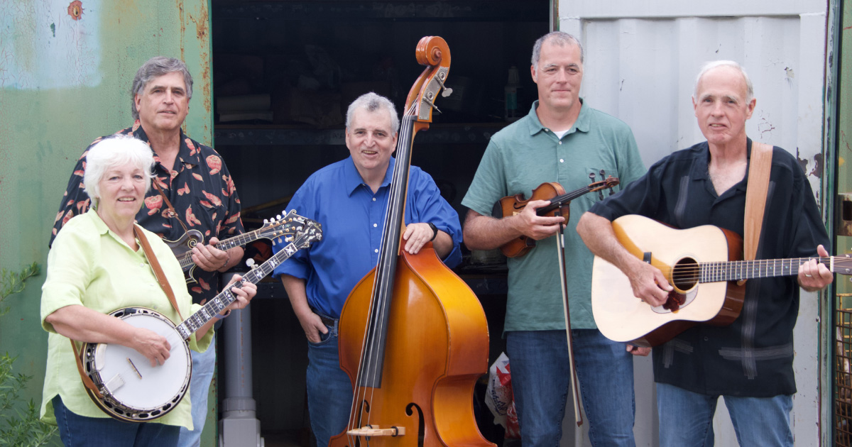 john and wendy mackin band photo showing the members smiling at the camera